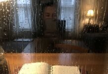 20 Wisdom Quotes to Help You Navigate Difficult Times Rainy window with journal and reflection.
