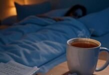 Evening Routine Checklist to Wind Down Like a Pro Cozy evening checklist with tea, notebook, dim bedroom.