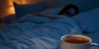 Evening Routine Checklist to Wind Down Like a Pro Cozy evening checklist with tea, notebook, dim bedroom.